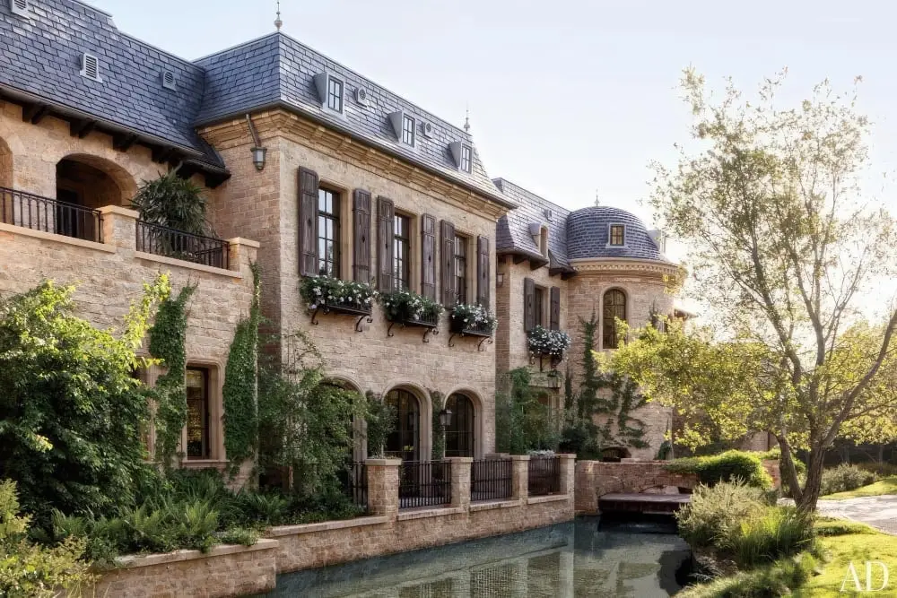 Stone mansion with balconies beside a canal