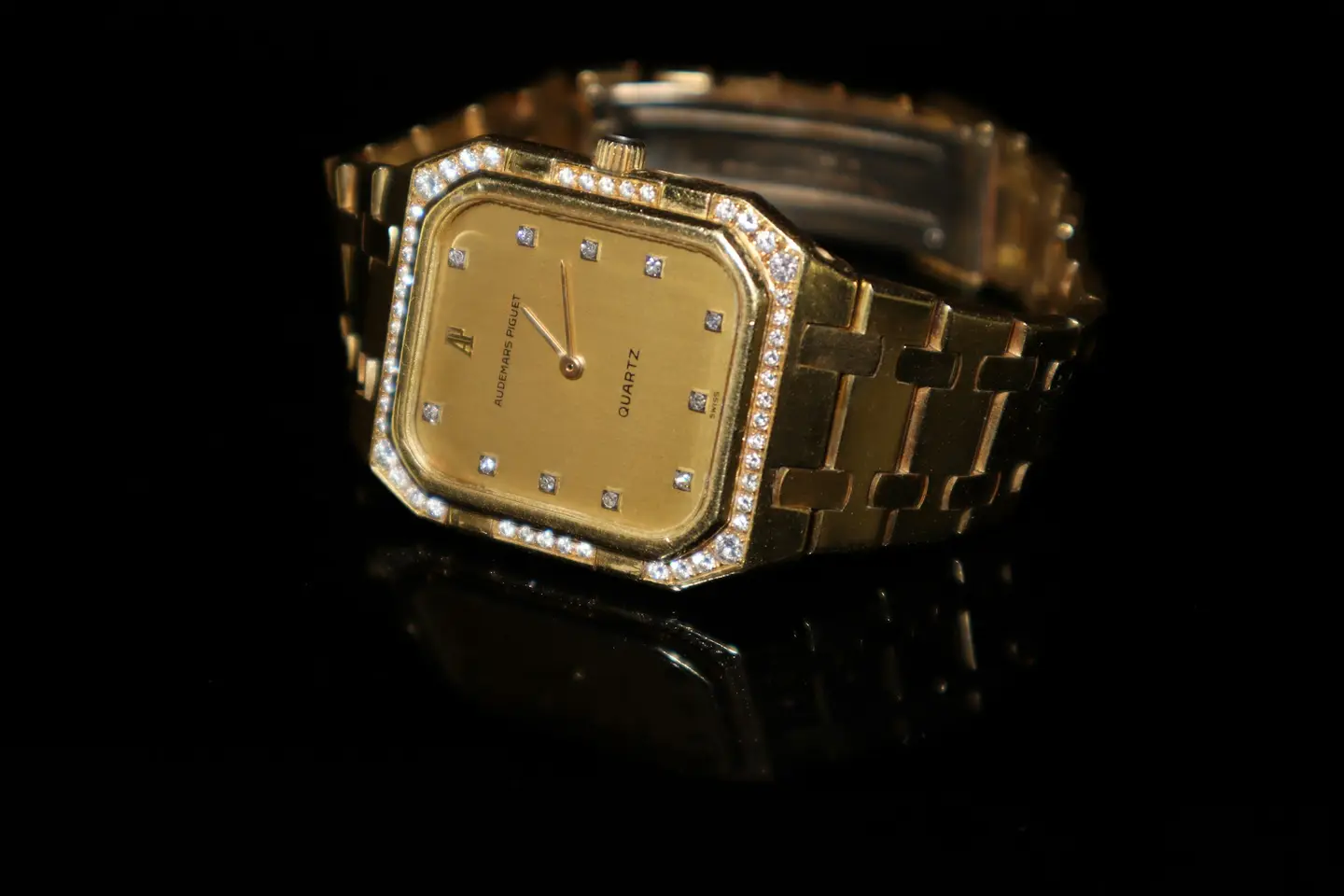Gold wristwatch set with diamonds