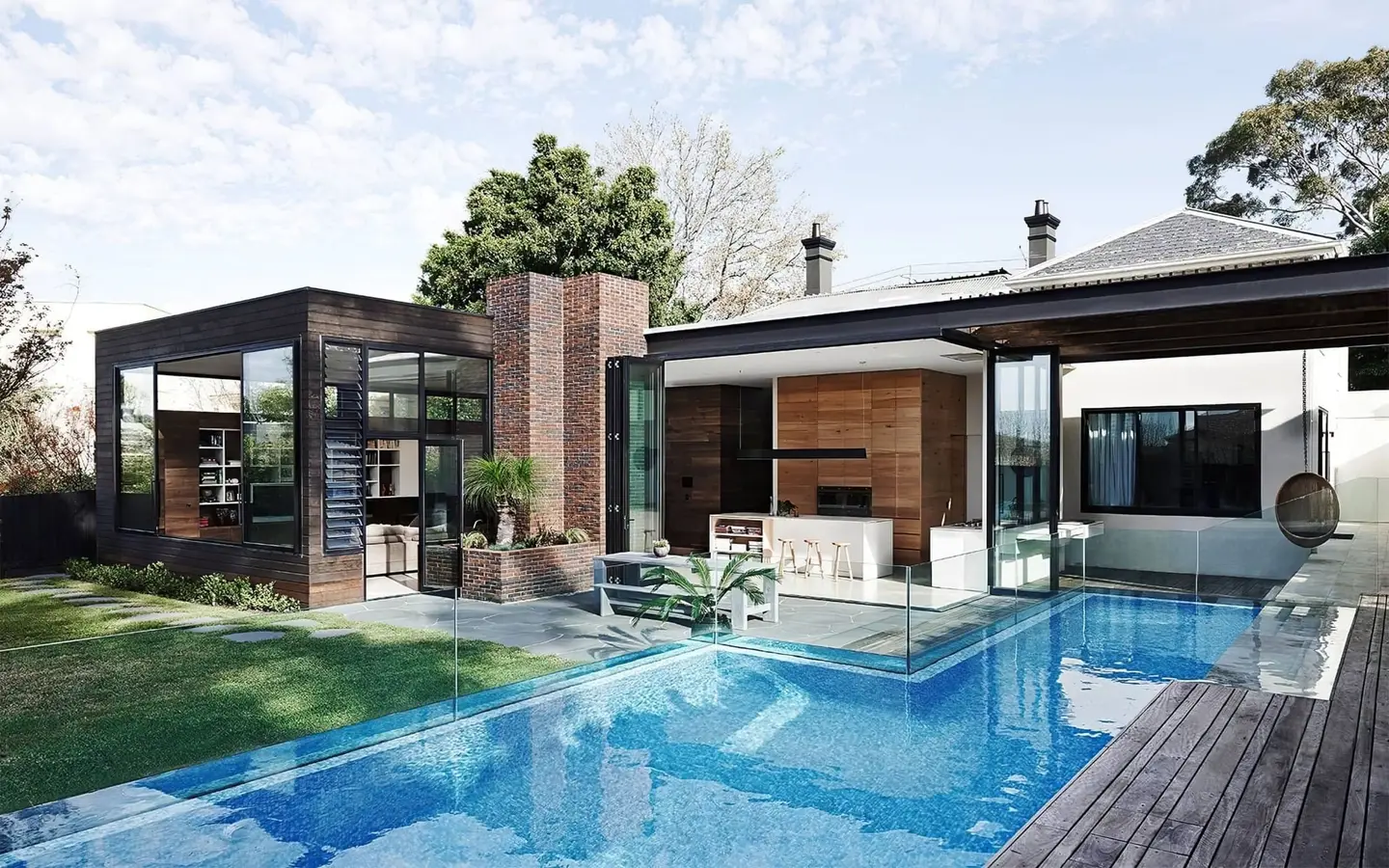 Modern house with a swimming pool and decking